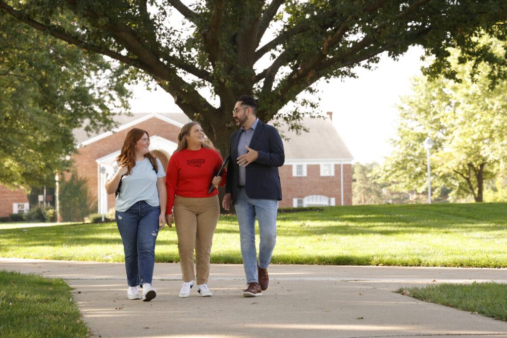 Teacher walking with students outside